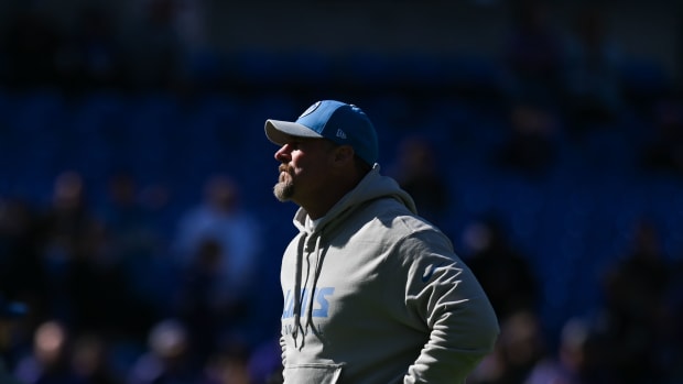 Detroit Lions head coach Dan Campbell stands on the field before the game against the Baltimore Ravens at M&T Bank Stadium.
